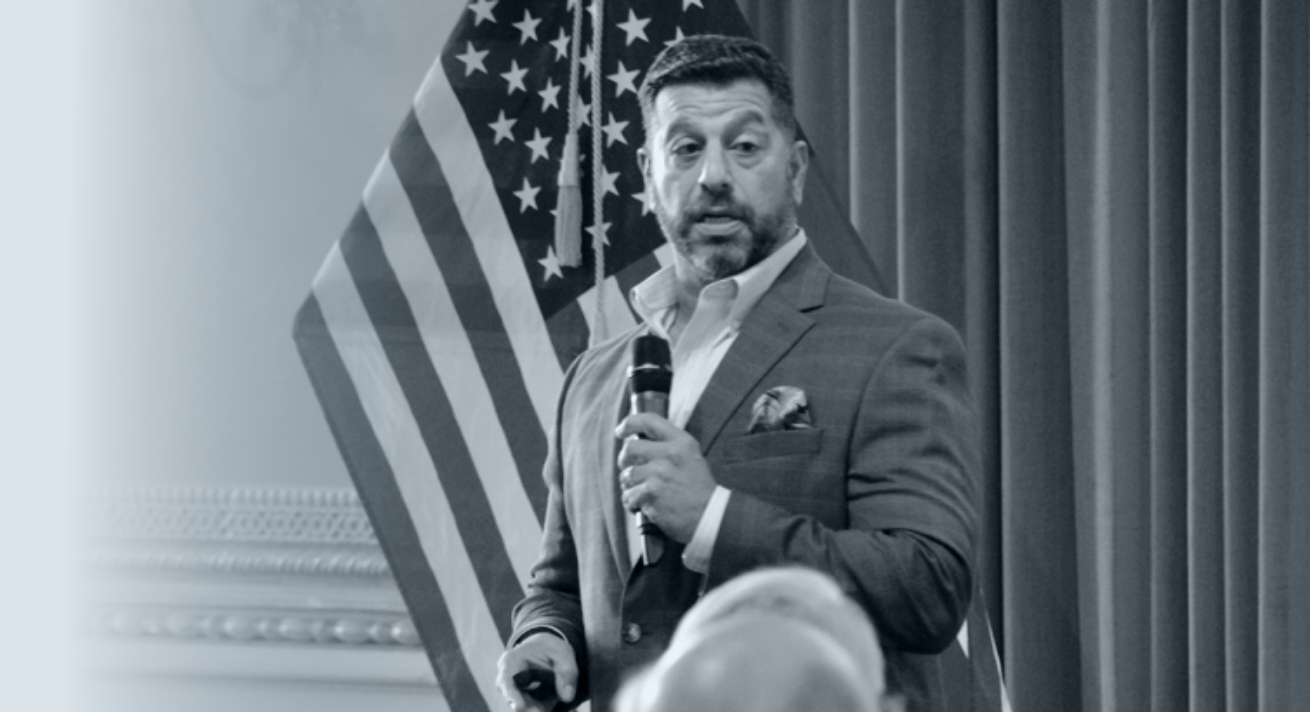 Man giving a public presentation - Wisdom to Wealth